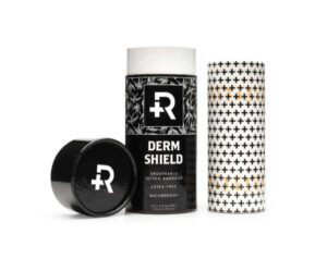 A black and white picture of some packaging for derm shield.